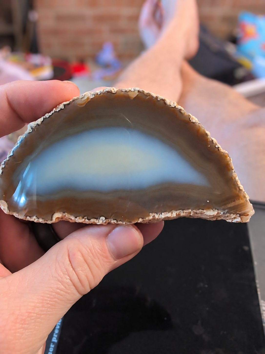 Natural agate slice held in a hand